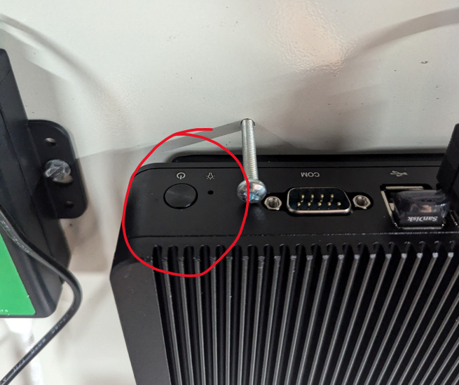 Upper-left power button used for a support-directed manual shutdown.